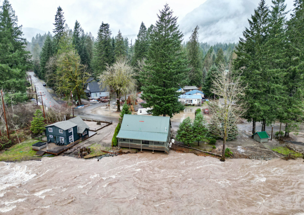Cowlitz River runs against bank of homes off of Slalom Way.